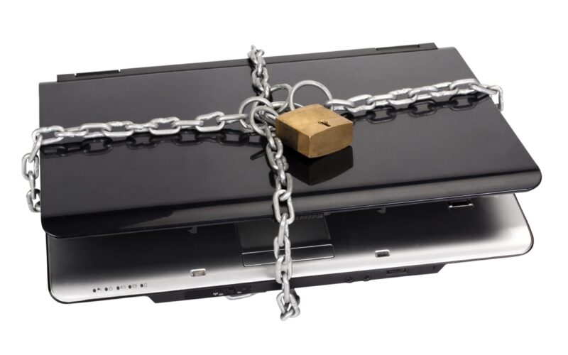 Laptop tied with chain and a padlock